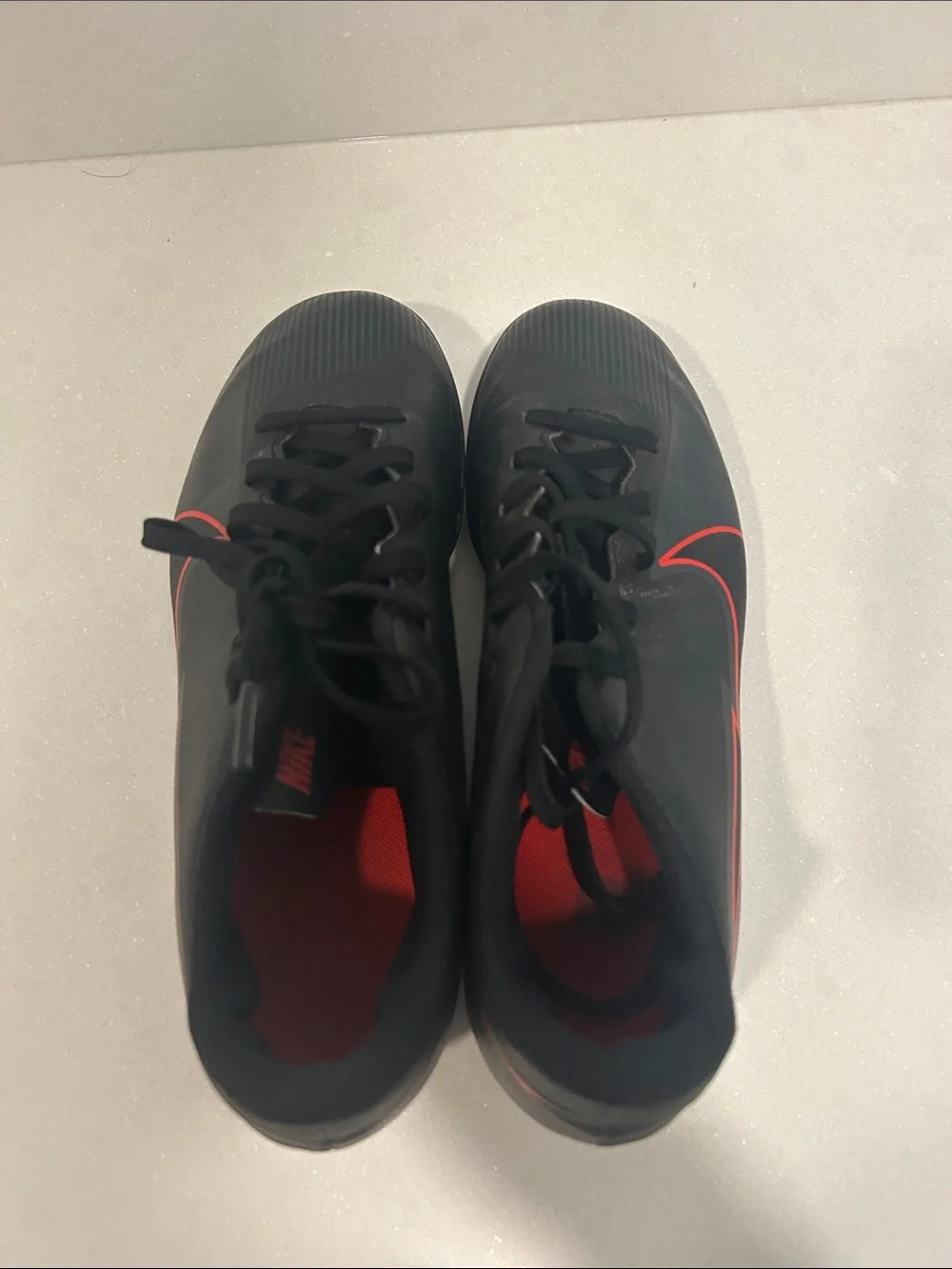 Kids Black Soccer Cleats with Red Accents